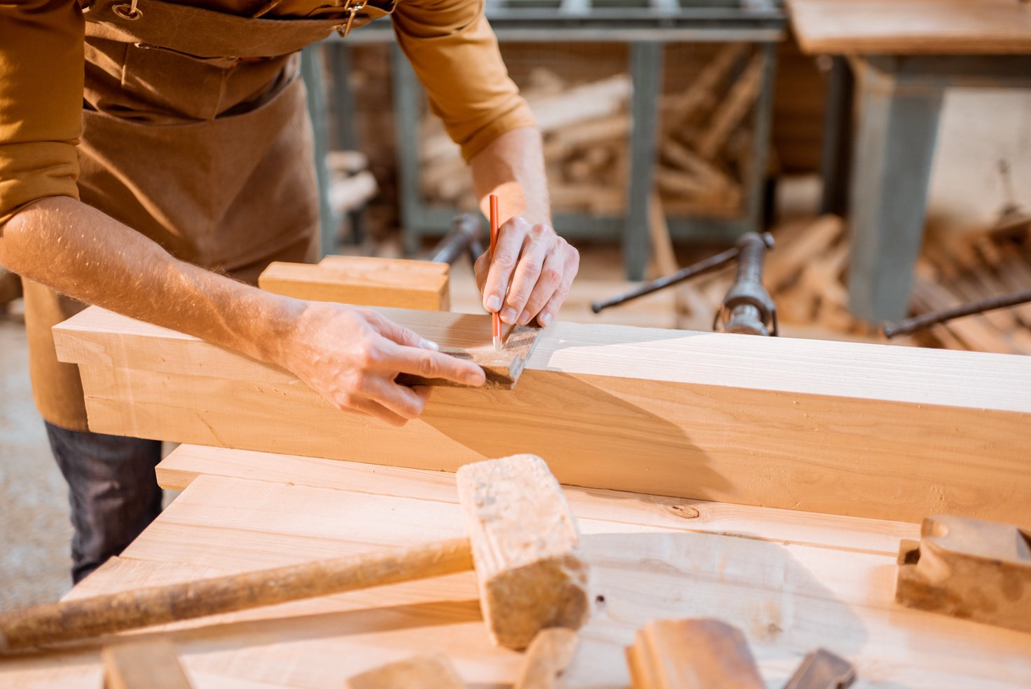 Carpenter Working on Wood in the Workshop